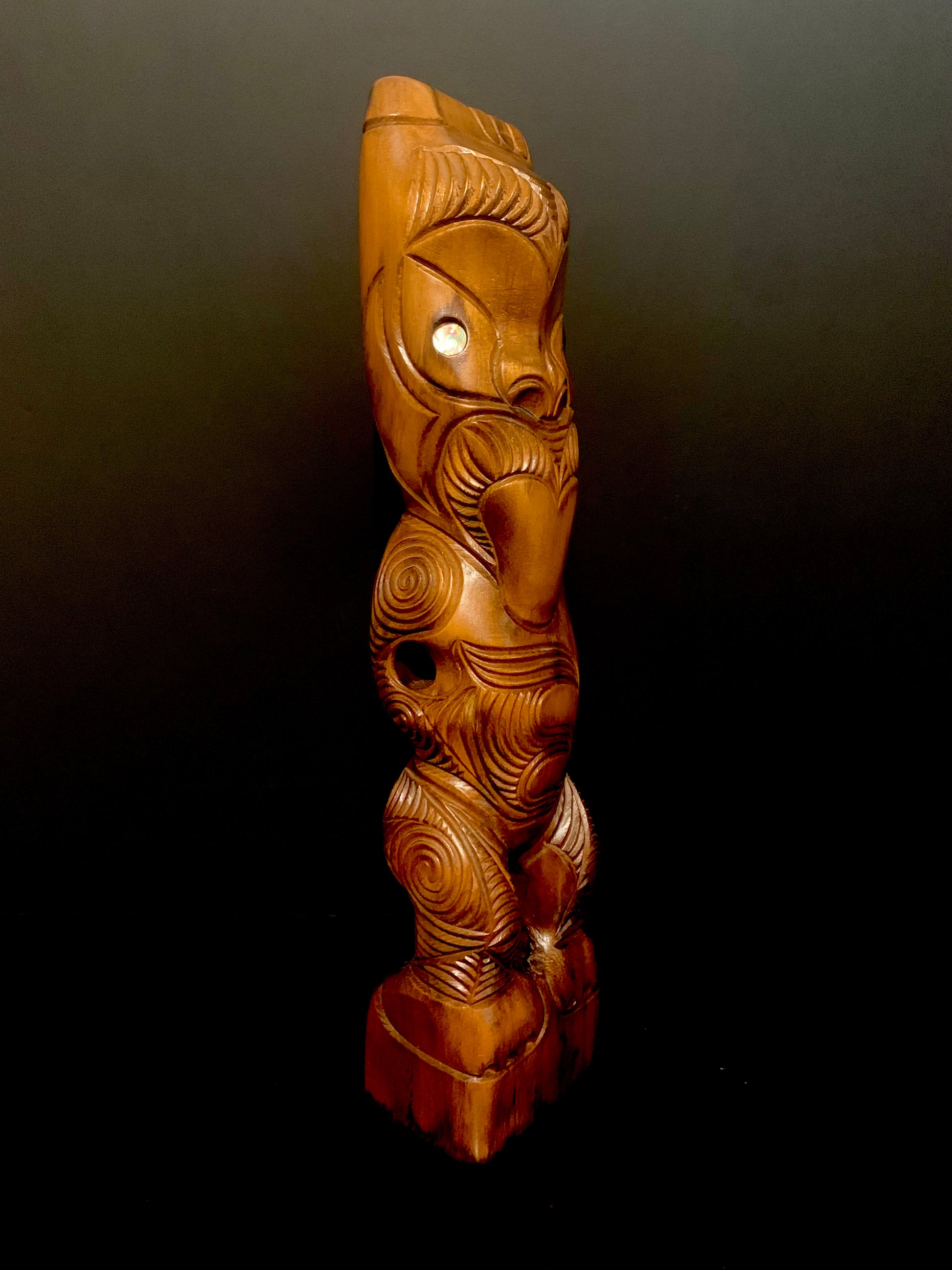 side view of Maori teko teko statue carved in New Zealand and available from Silver Fern Gallery