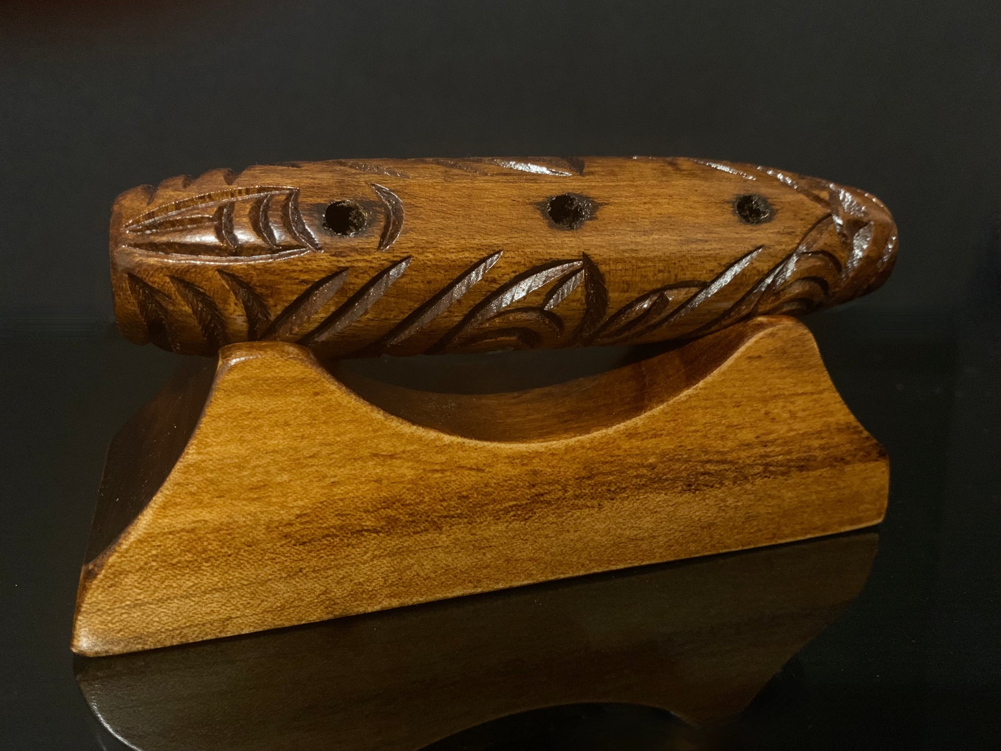 Koauau flute on stand carved in New Zealand and available from Silver Fern Gallery