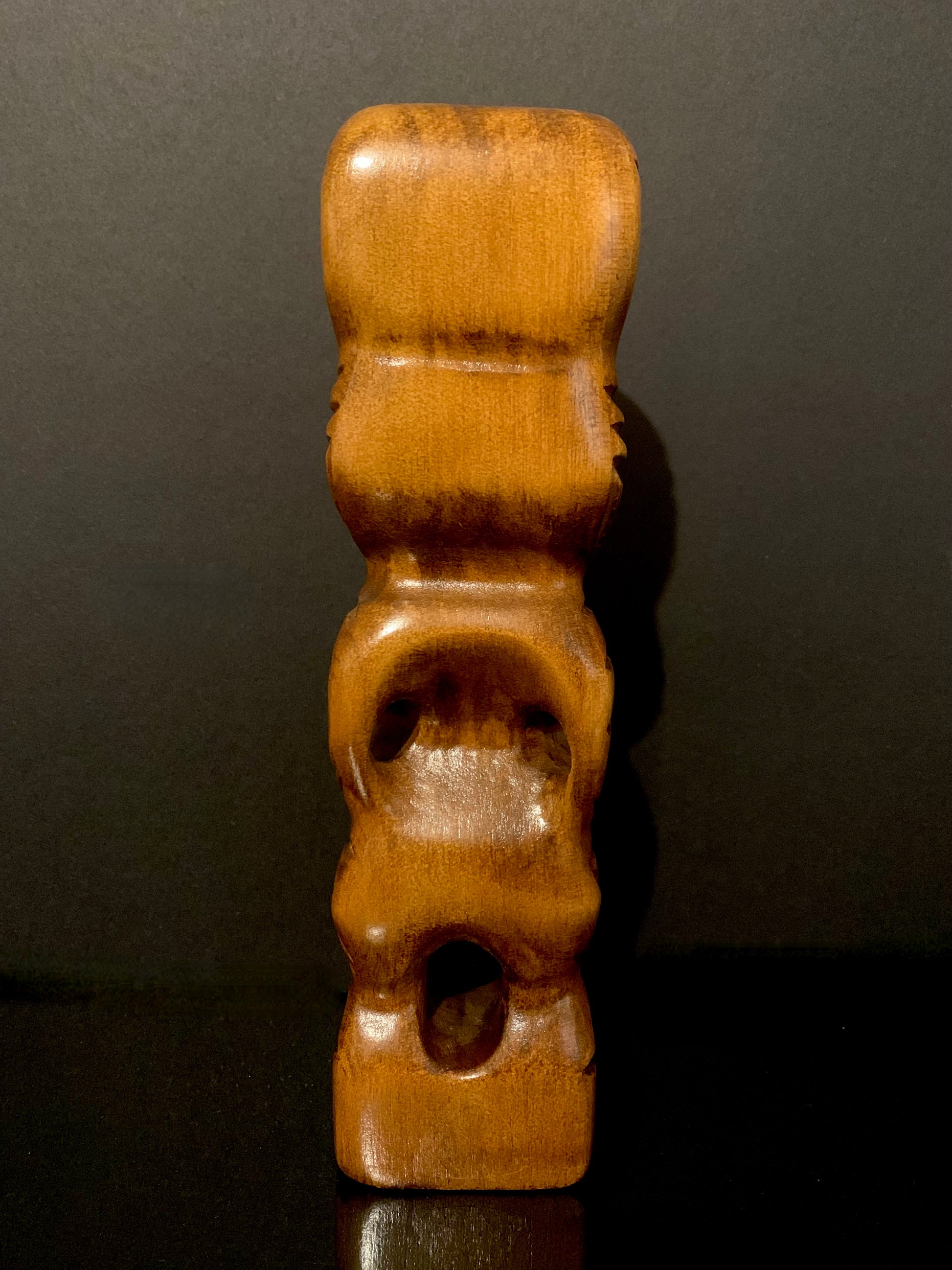 back view of Maori teko teko carved in New Zealand by Wood Masters available from Silver Fern Gallery