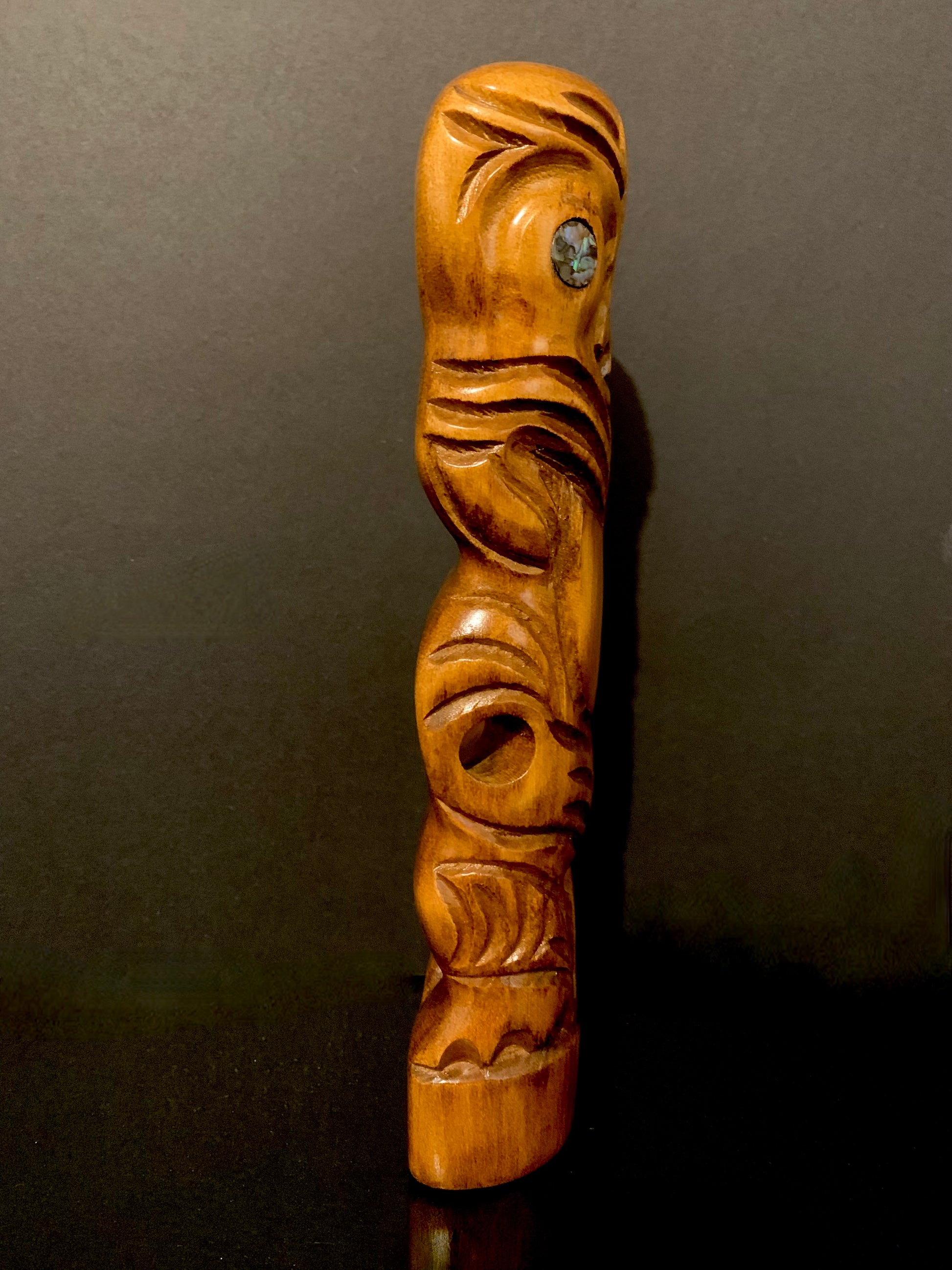 view of Maori teko teko statue looking right 