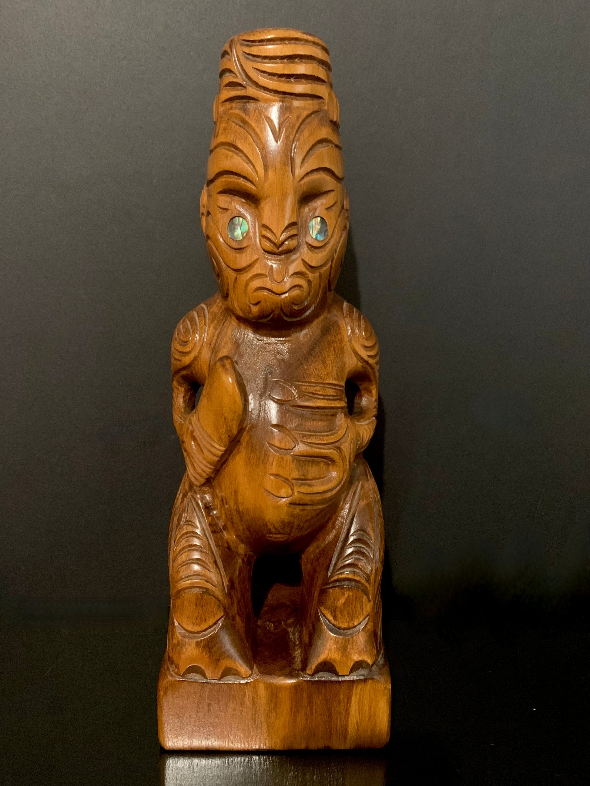 front view of Maori teko teko with patu carved in New Zealand by Wood Masters available from Silver Fern Gallery