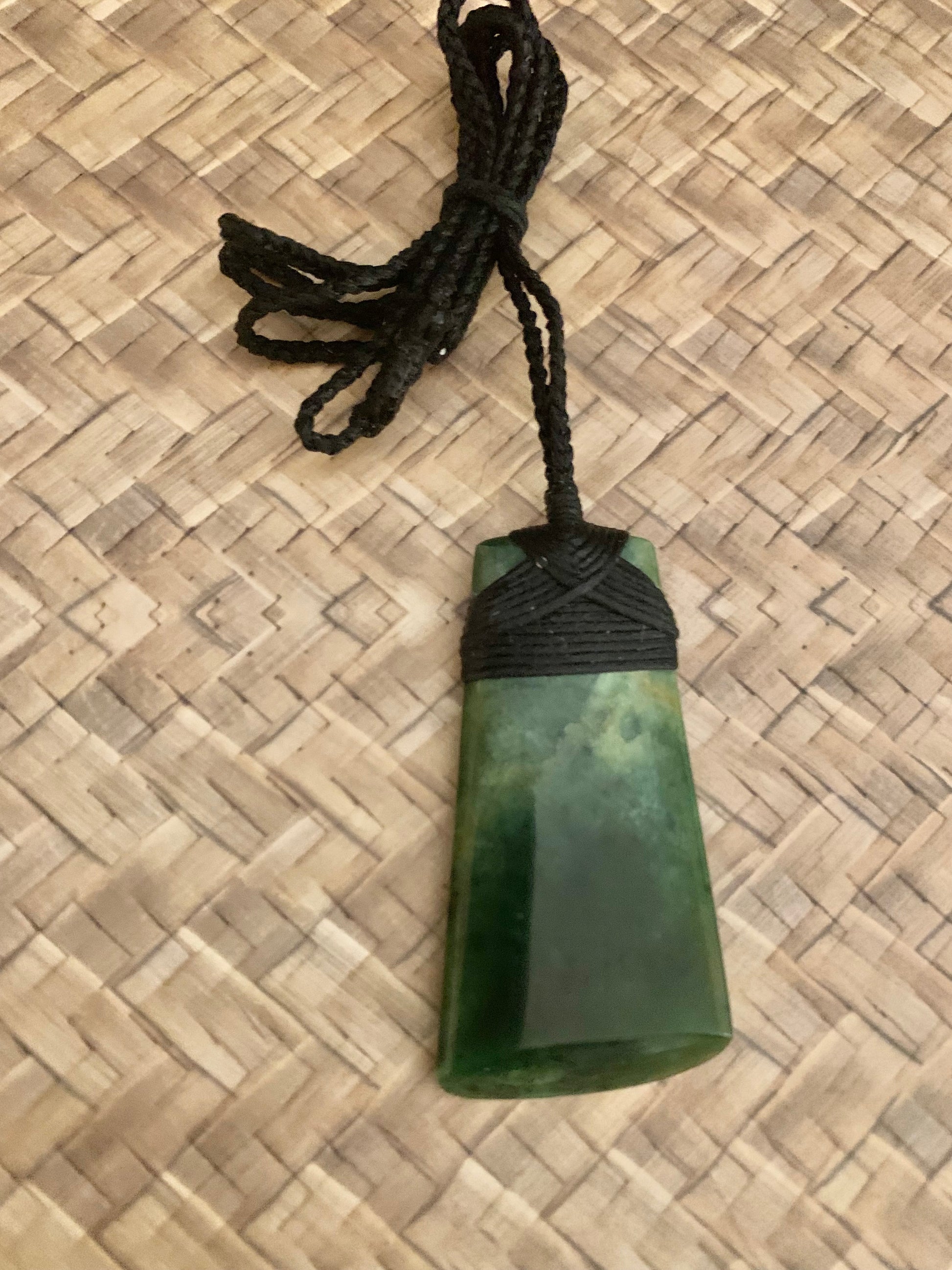 Maori Pounamu hei toki adornment from New Zealand available at Silver Fern Gallery