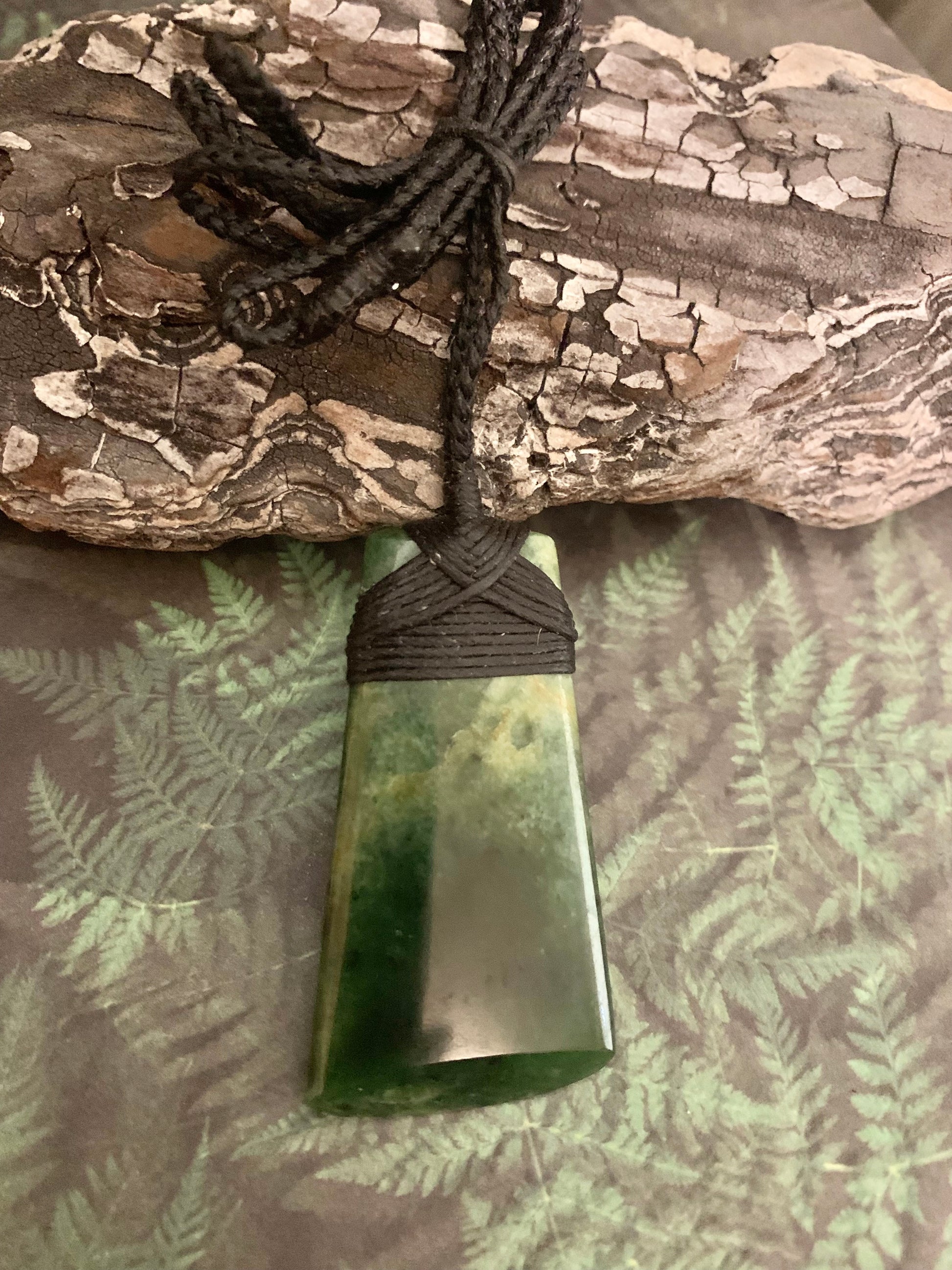 Maori Pounamu hei toki adornment from New Zealand available at Silver Fern Gallery