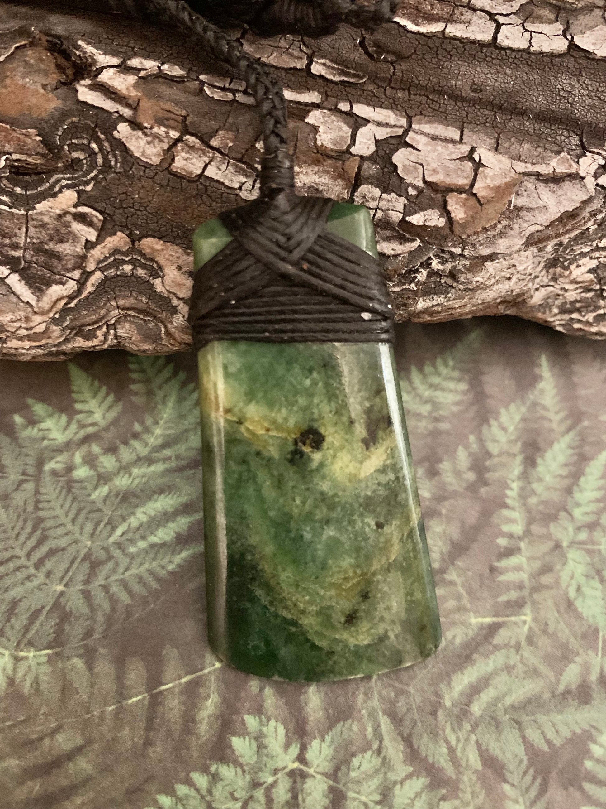 Maori Pounamu hei toki adornment from New Zealand available at Silver Fern Gallery