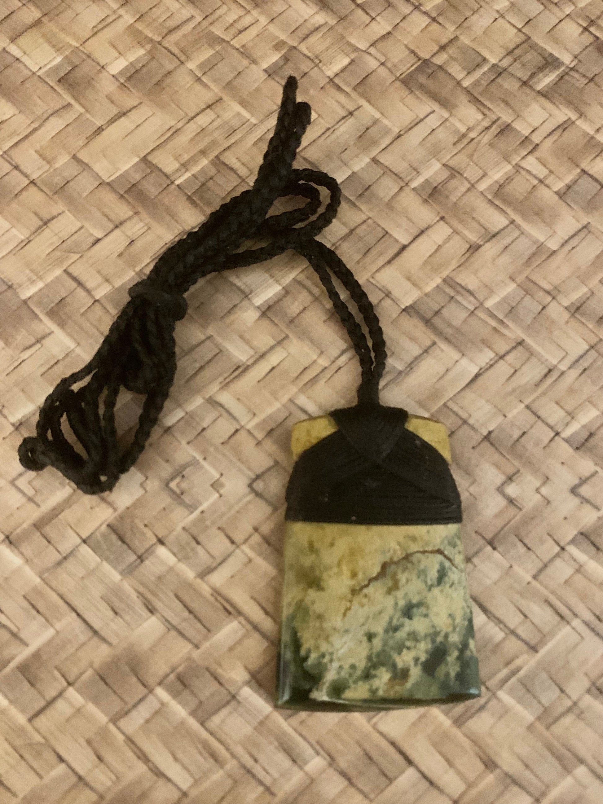 reverse side of Maori Flower Jade Pounamu hei toki pendant from New Zealand available to purchase