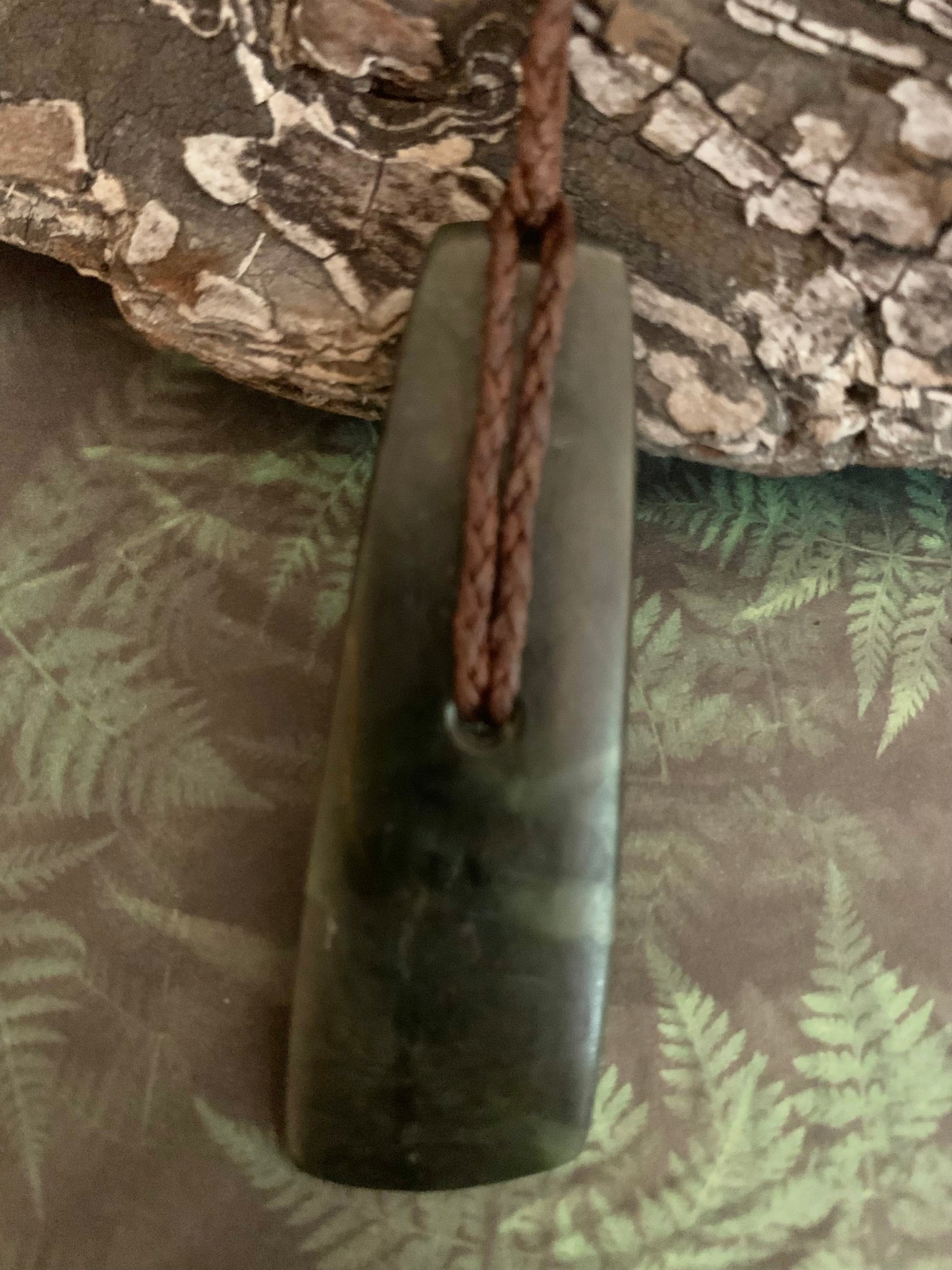 reverse of Maori Pounamu hei toki pendant from New Zealand available to purchase