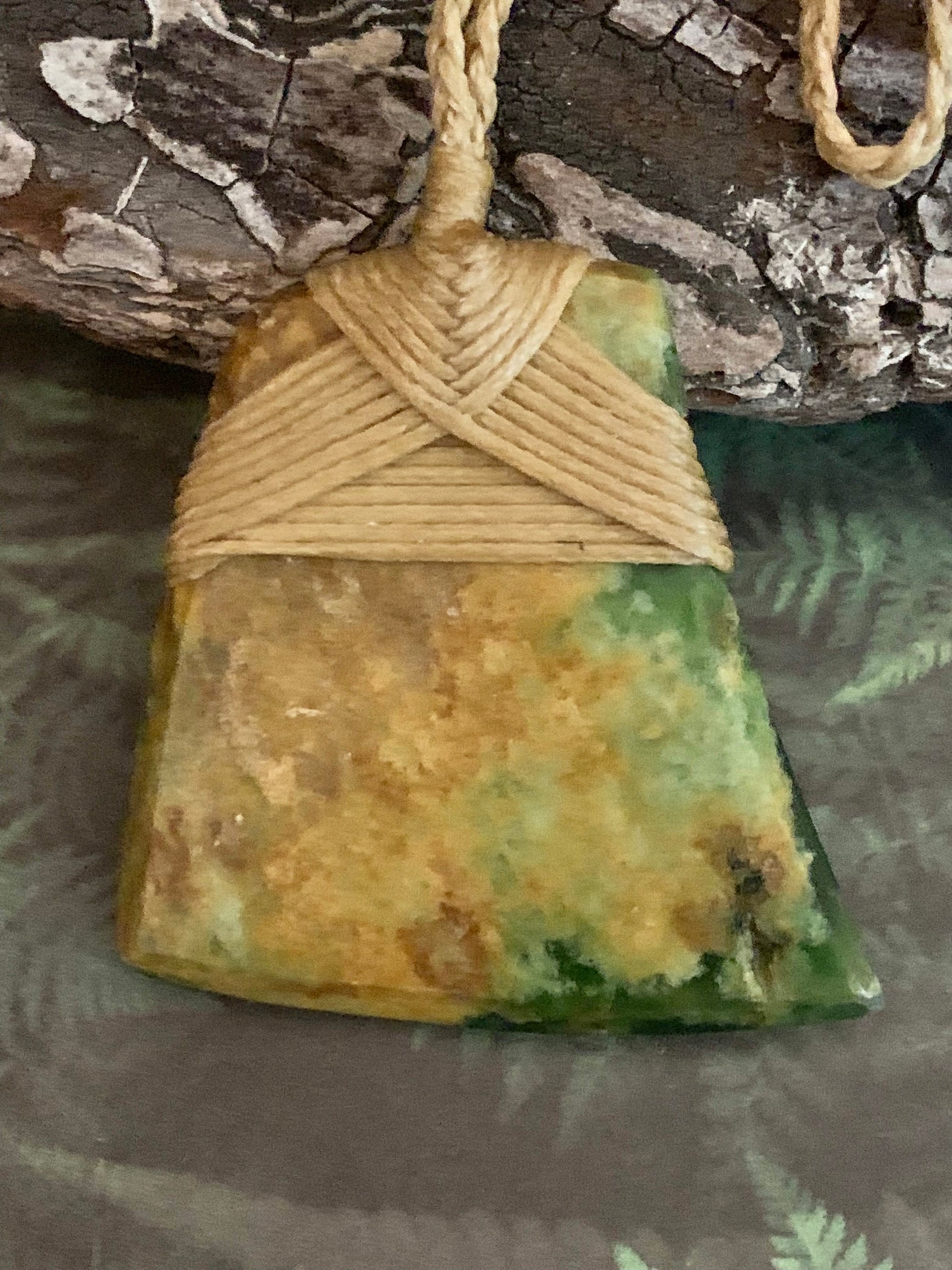 Maori Flower Jade Pounamu hei toki pendant by Alex Sands from New Zealand available to purchase