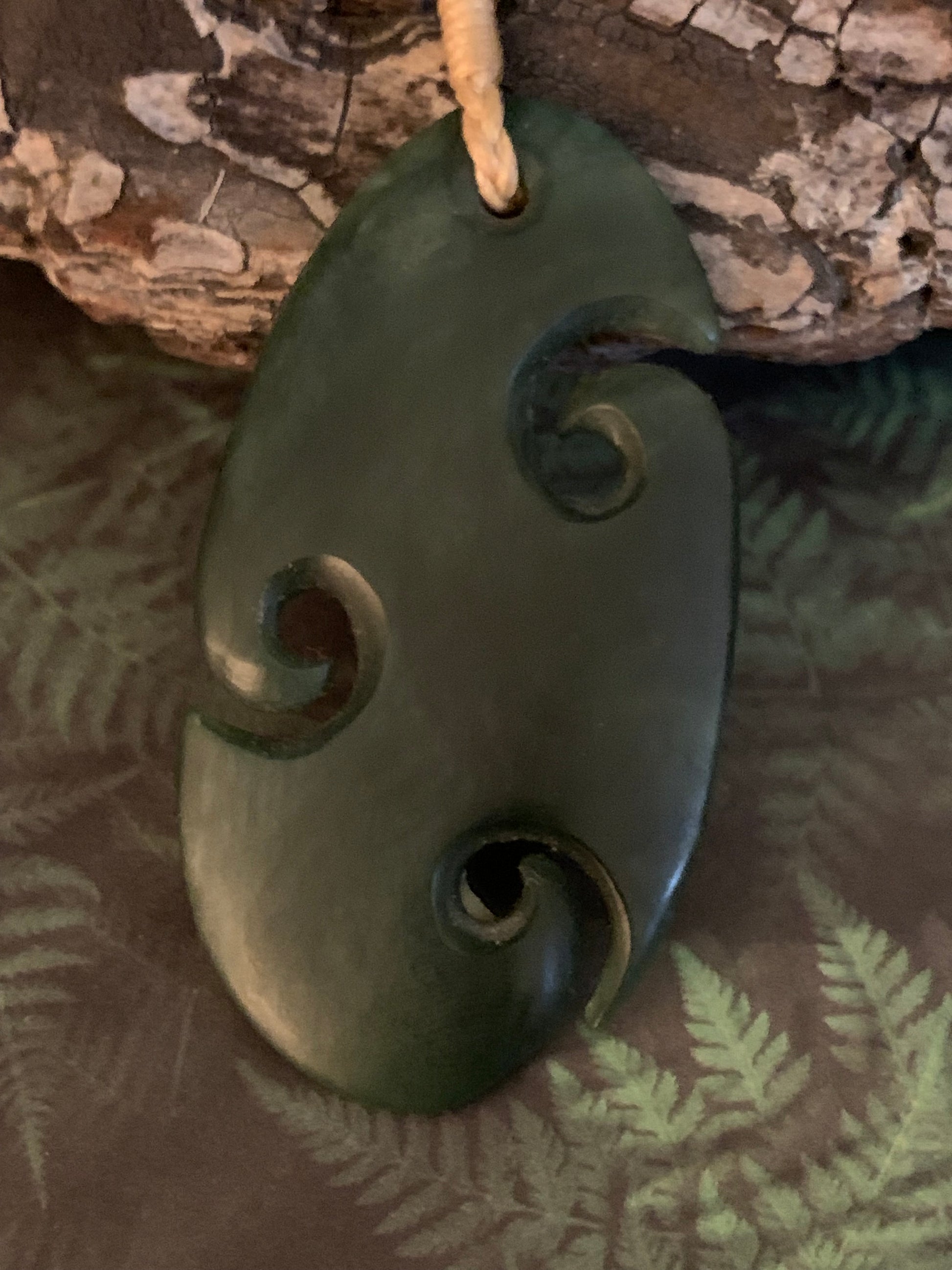 Pounamu triple koru pendant from New Zealand available from Silver Fern Gallery