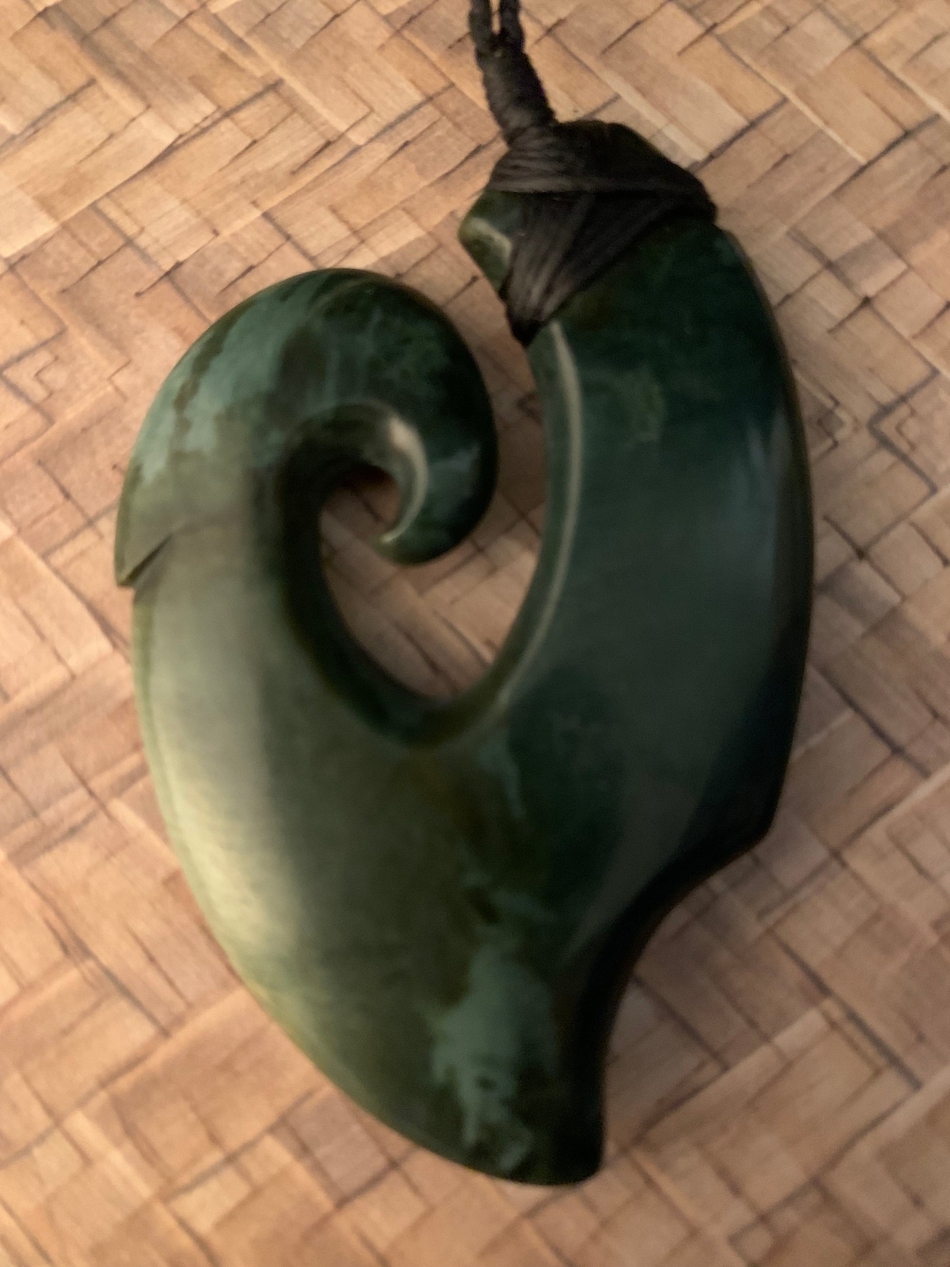 Maori Pounamu hei matau fish hook adornment from New Zealand available at Silver Fern Gallery