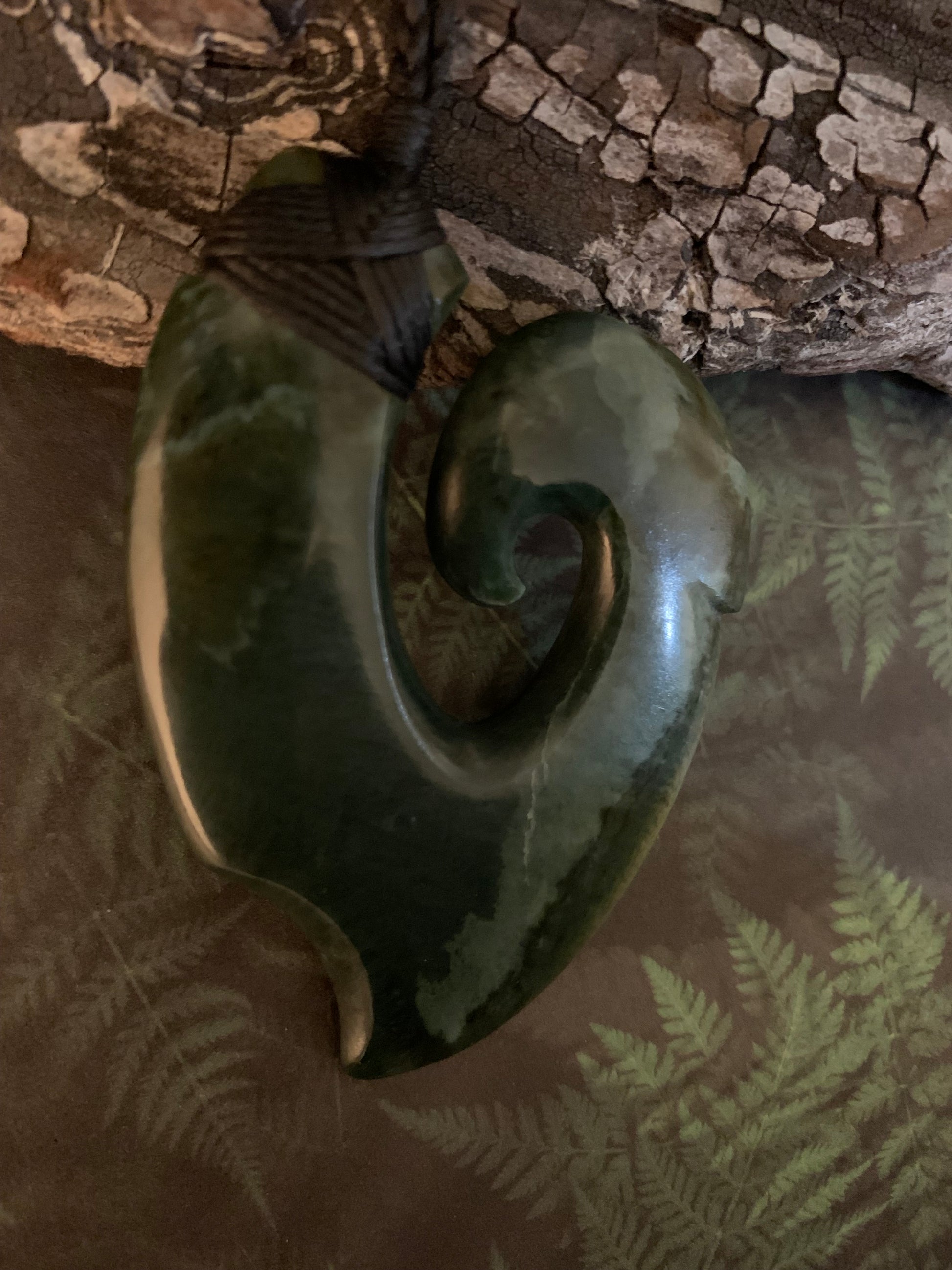 Maori Pounamu hei matau fish hook adornment from New Zealand available at Silver Fern Gallery