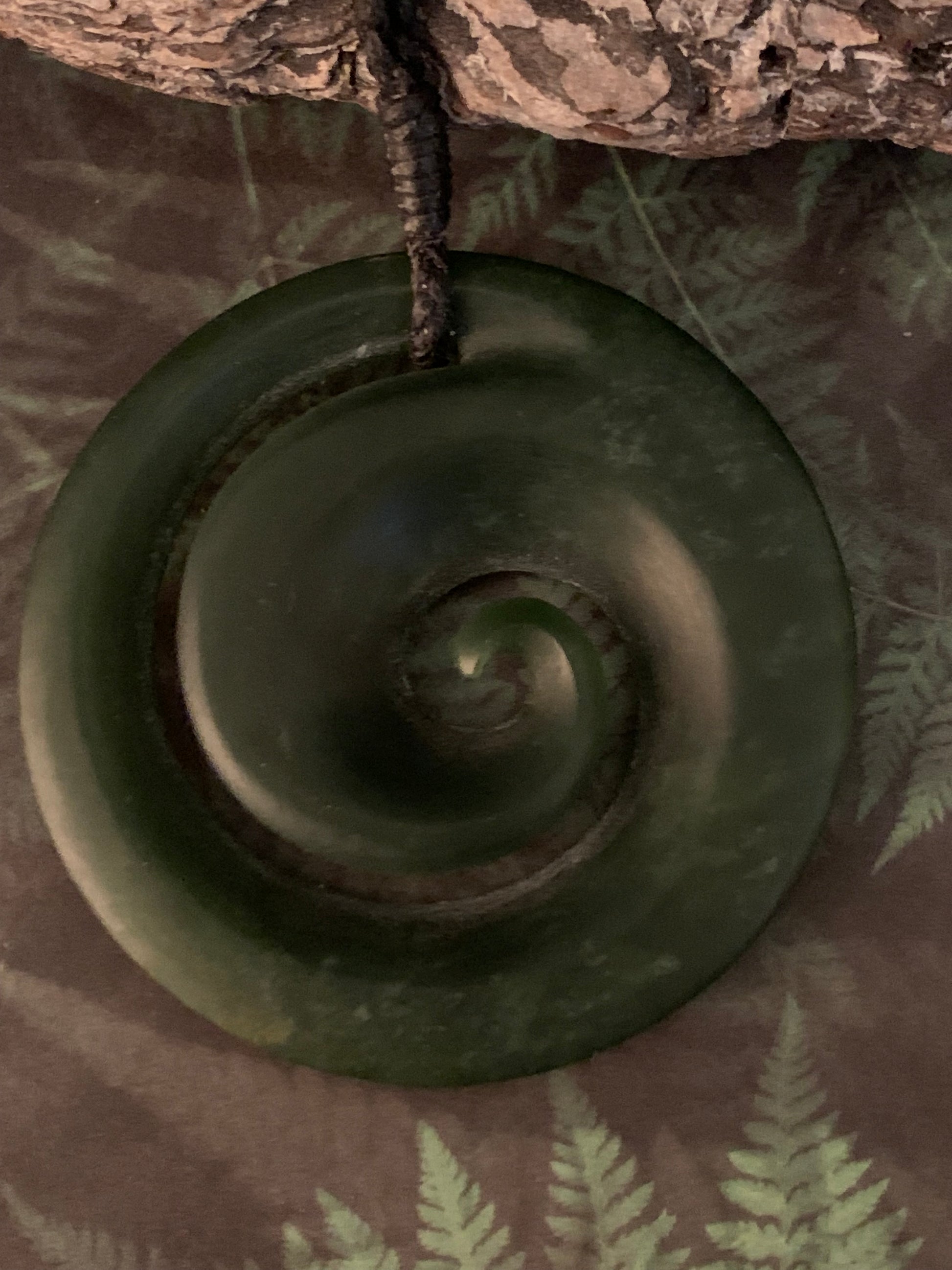 Pounamu koru pendant from New Zealand available from Silver Fern Gallery