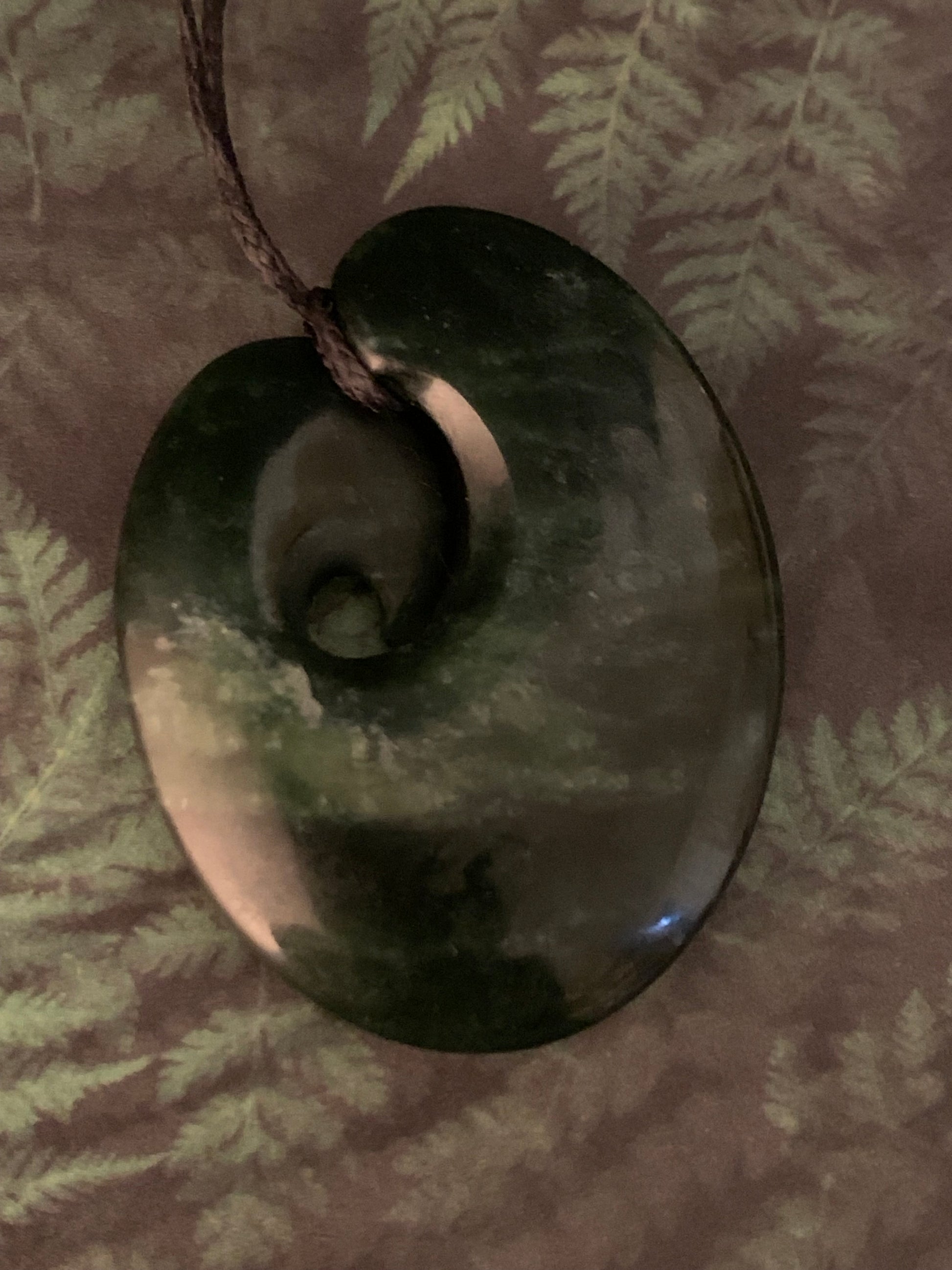 showing reverse of contemporary greenstone hei matau made in new zealand available for purchase from Silver Fern Gallery