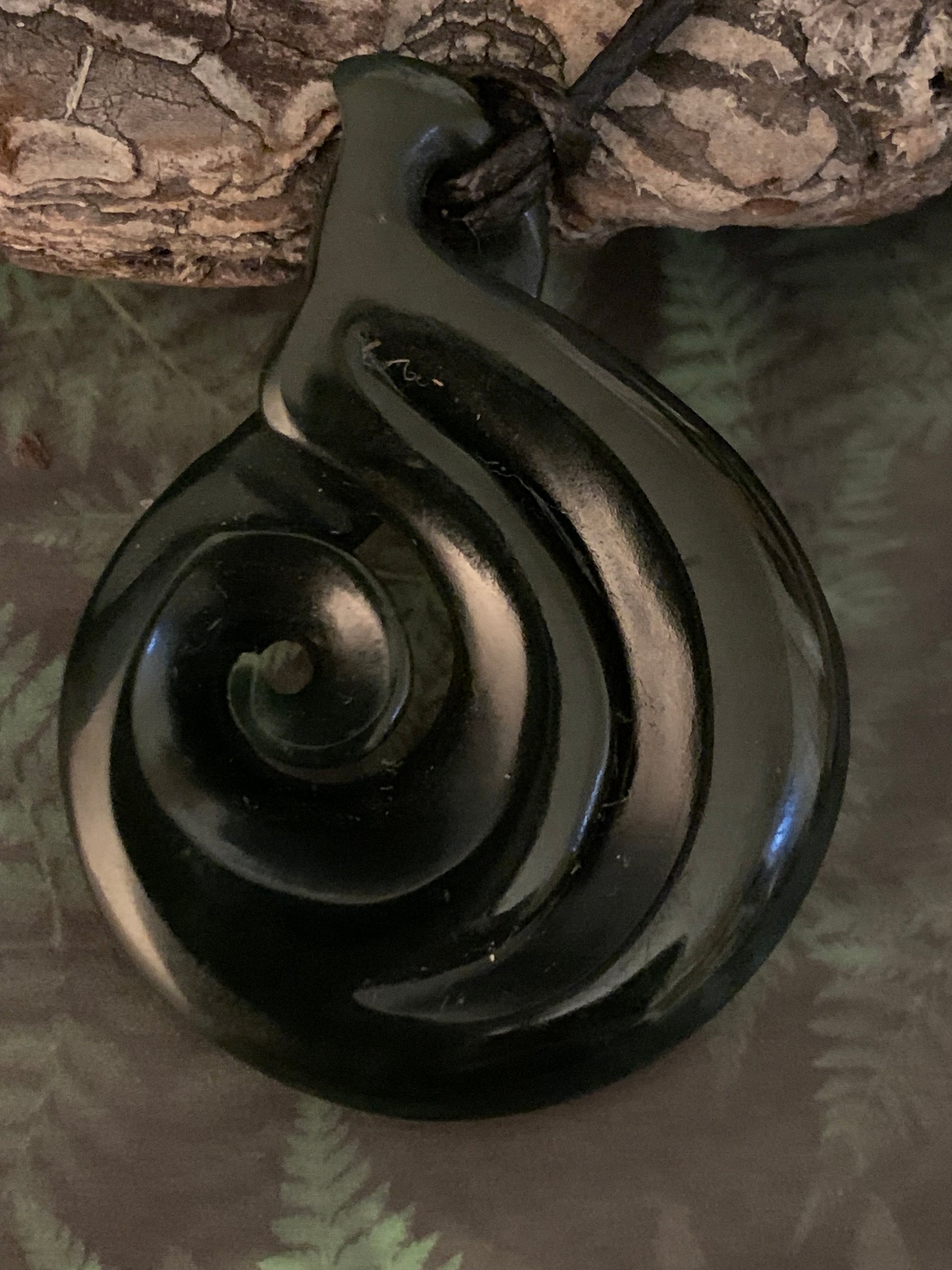 Pounamu koru twist pendant from New Zealand available from Silver Fern Gallery