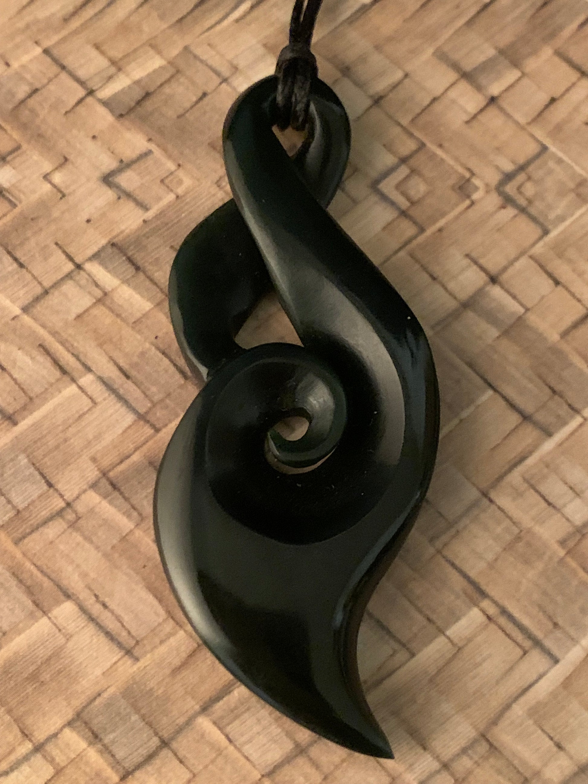 reverse side of NZ jade twist pendant with koru detail