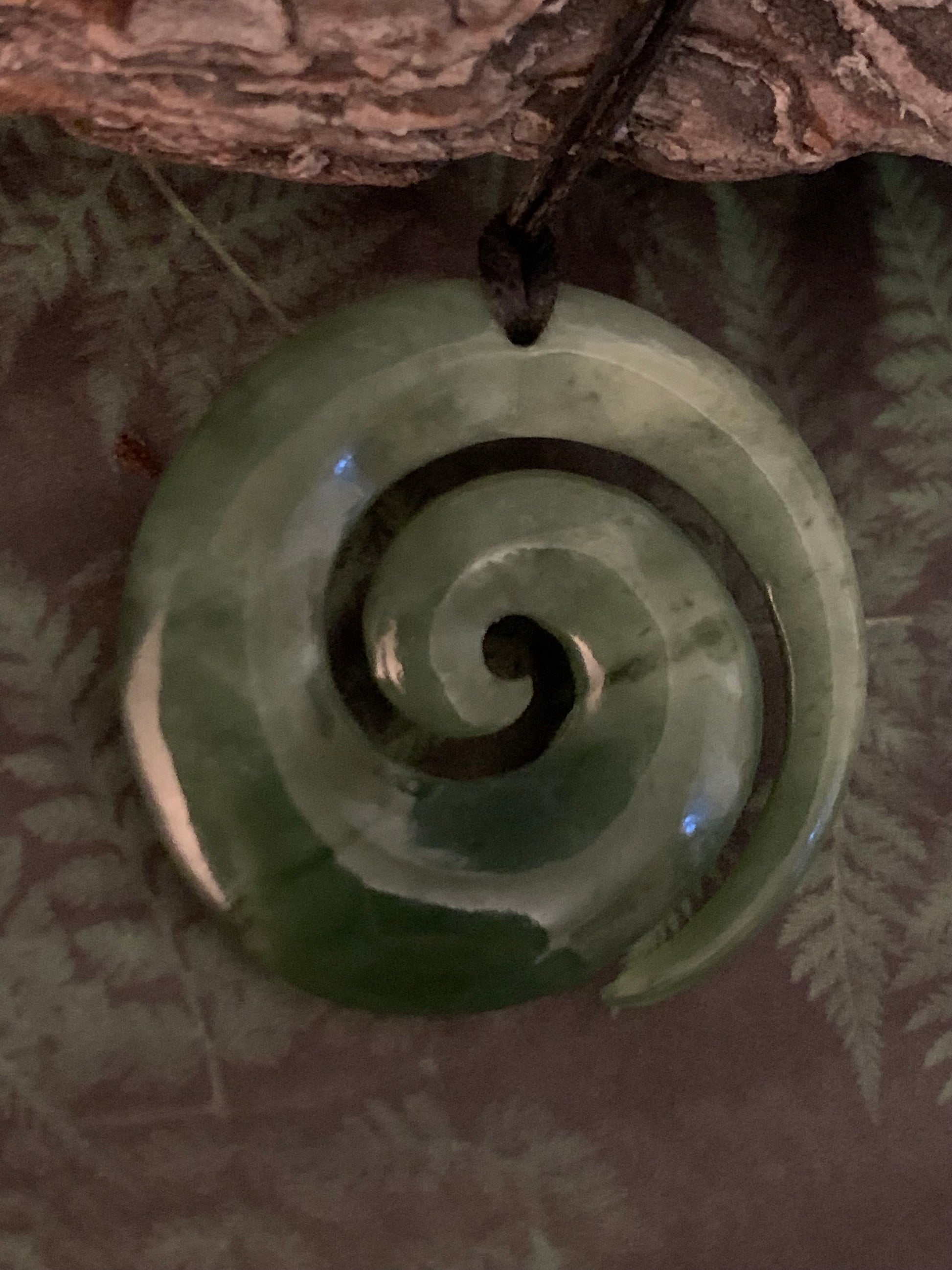 light coloured Pounamu koru pendant from New Zealand available from Silver Fern Gallery