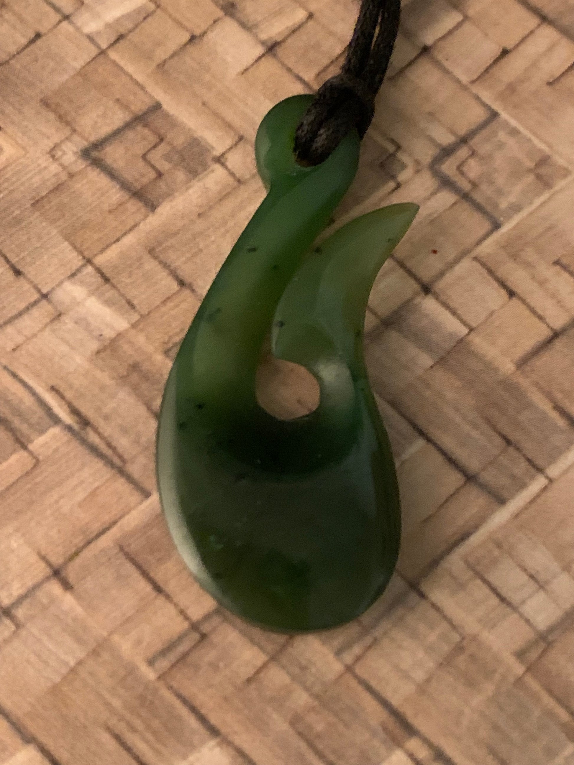 New Zealand Maori hei matau pounamu adornment available from Silver Fern gallery