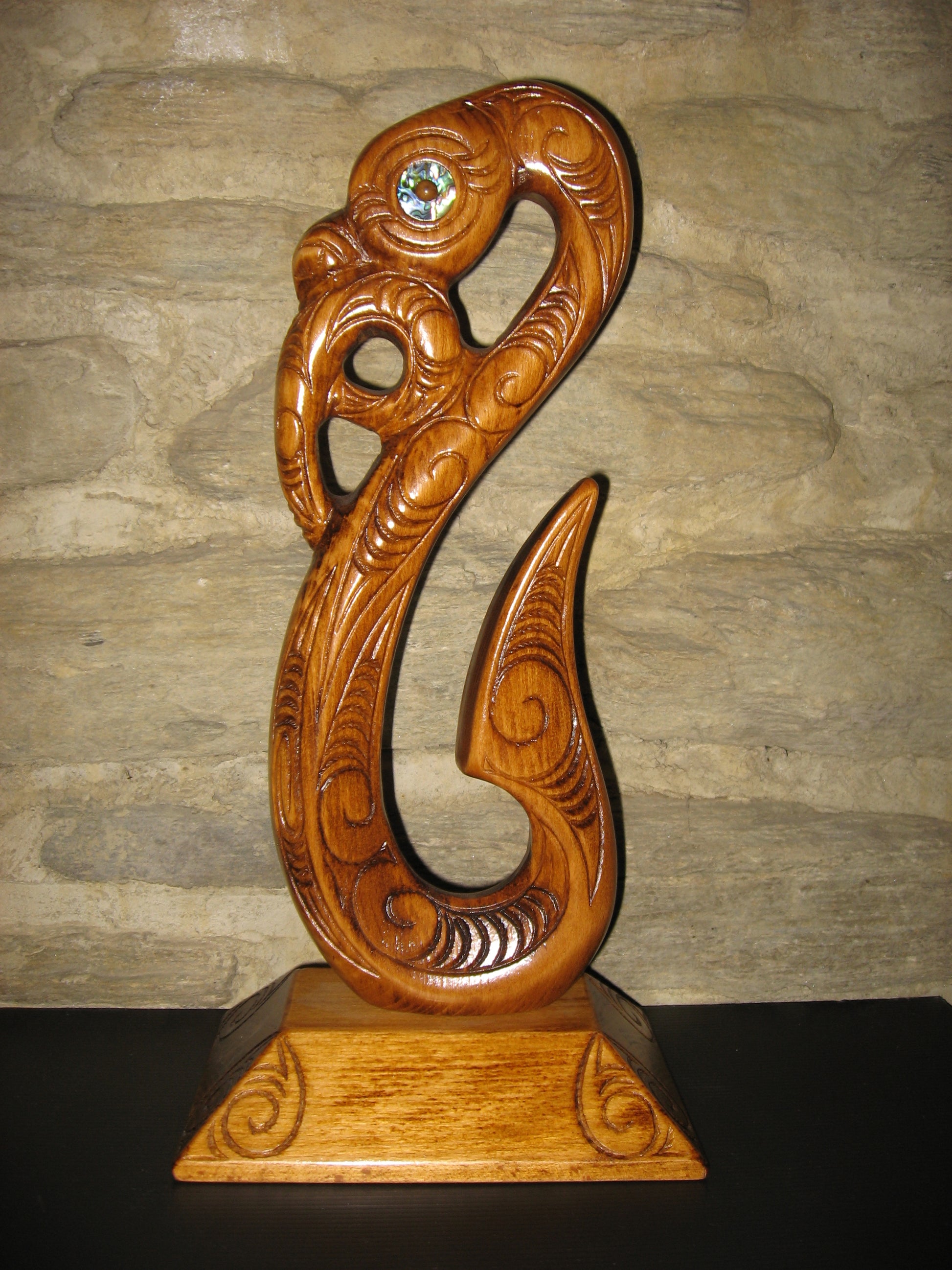Maori medium matau fish hook carved in New Zealand and available from Silver Fern Gallery