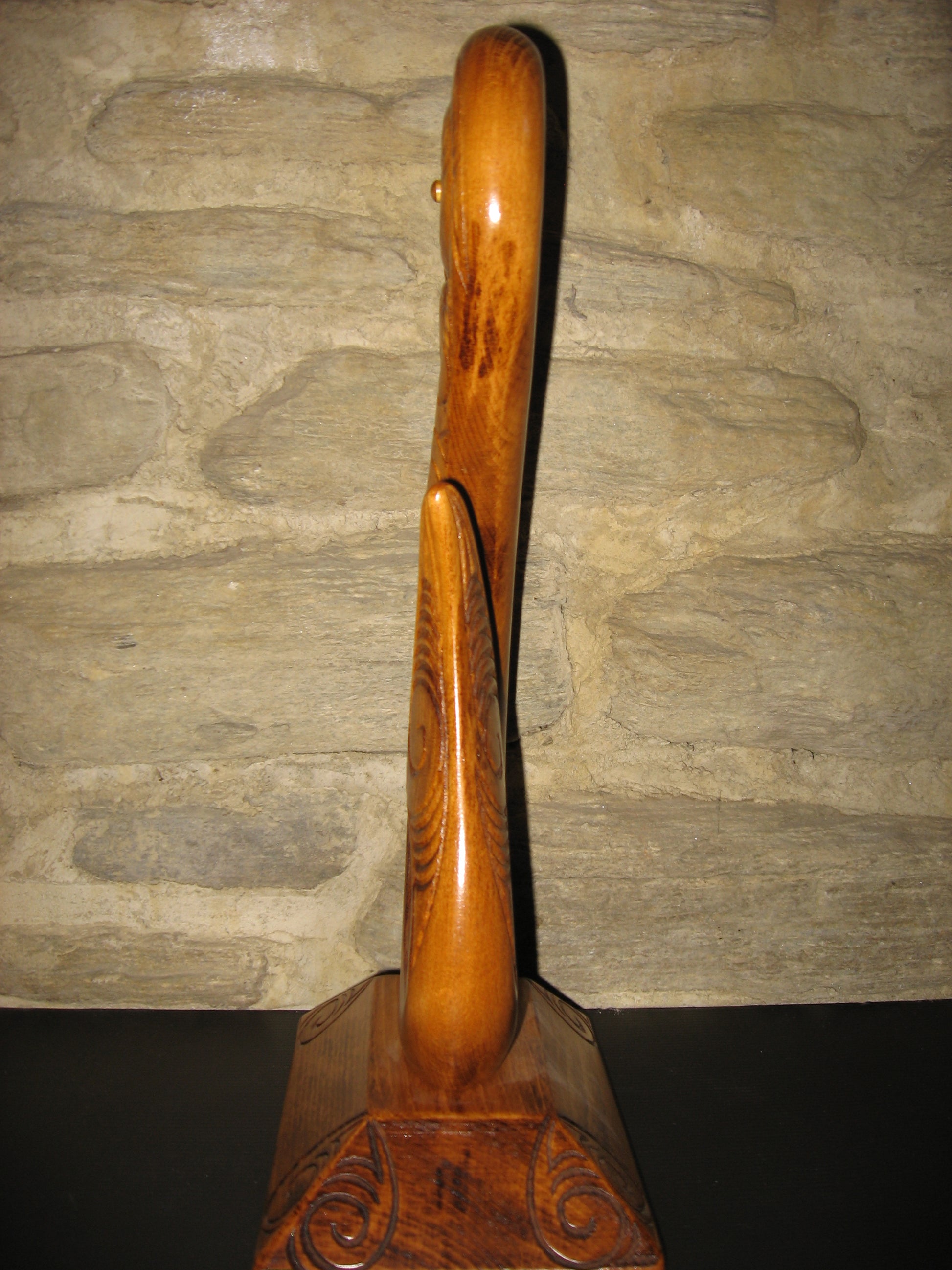 side view of Maori medium matau fish hook carved in New Zealand and available from Silver Fern Gallery