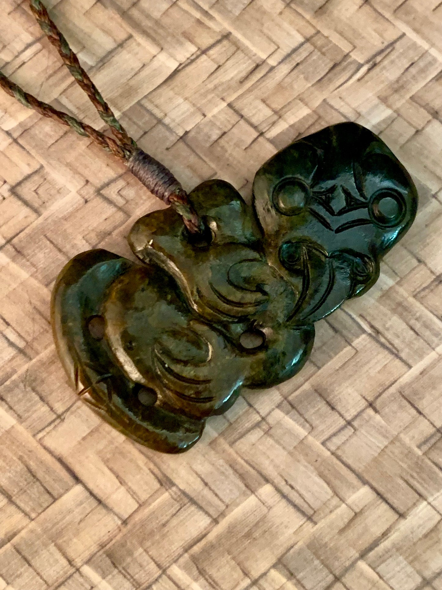 Maori tiki pendant from New Zealand.  Regarded as a fertility symbol or good luck symbol.