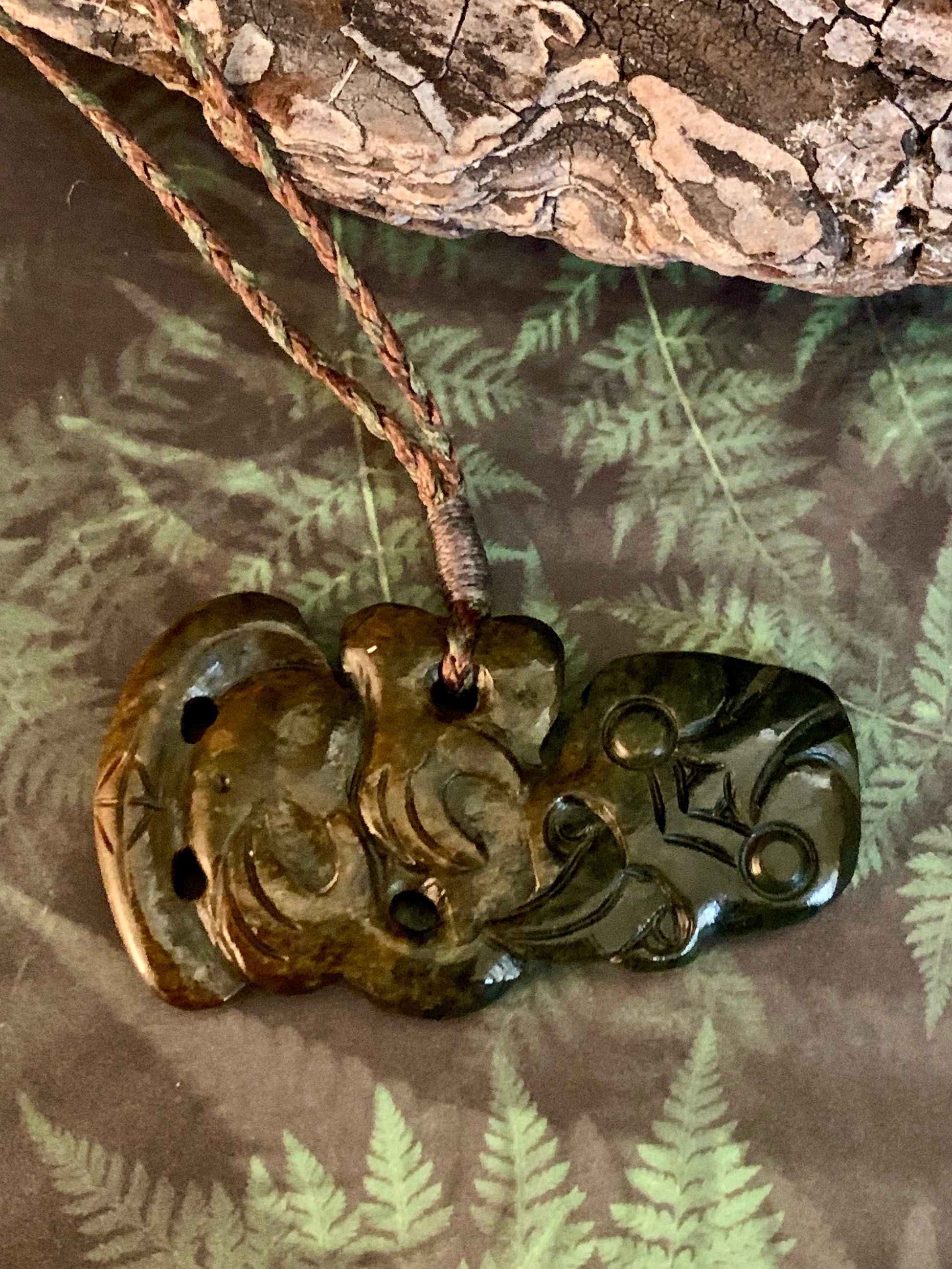 Pounamu tiki pendant available from Silver Fern Gallery 