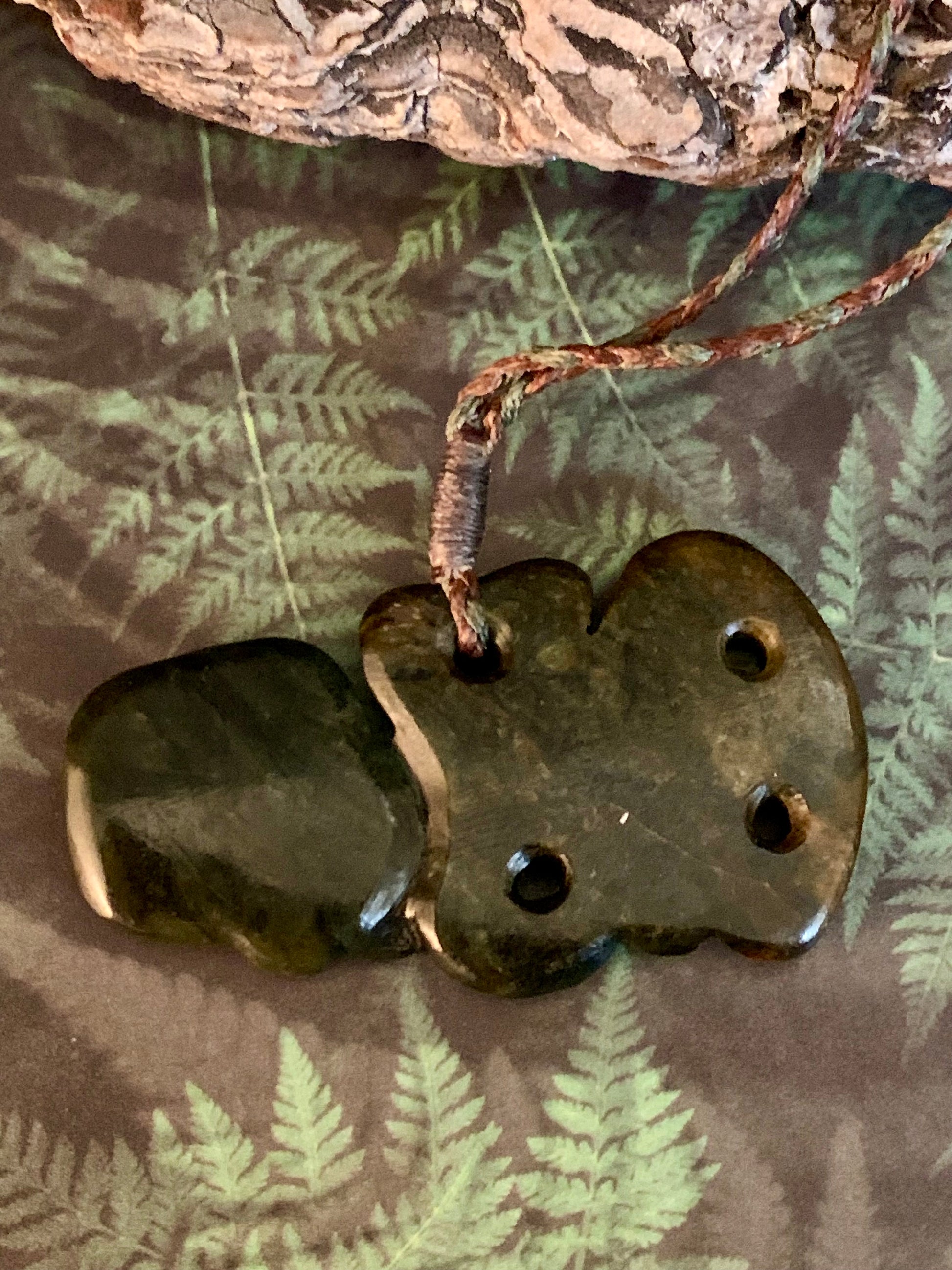 back view of Pounamu tiki pendant available from Silver Fern Gallery 