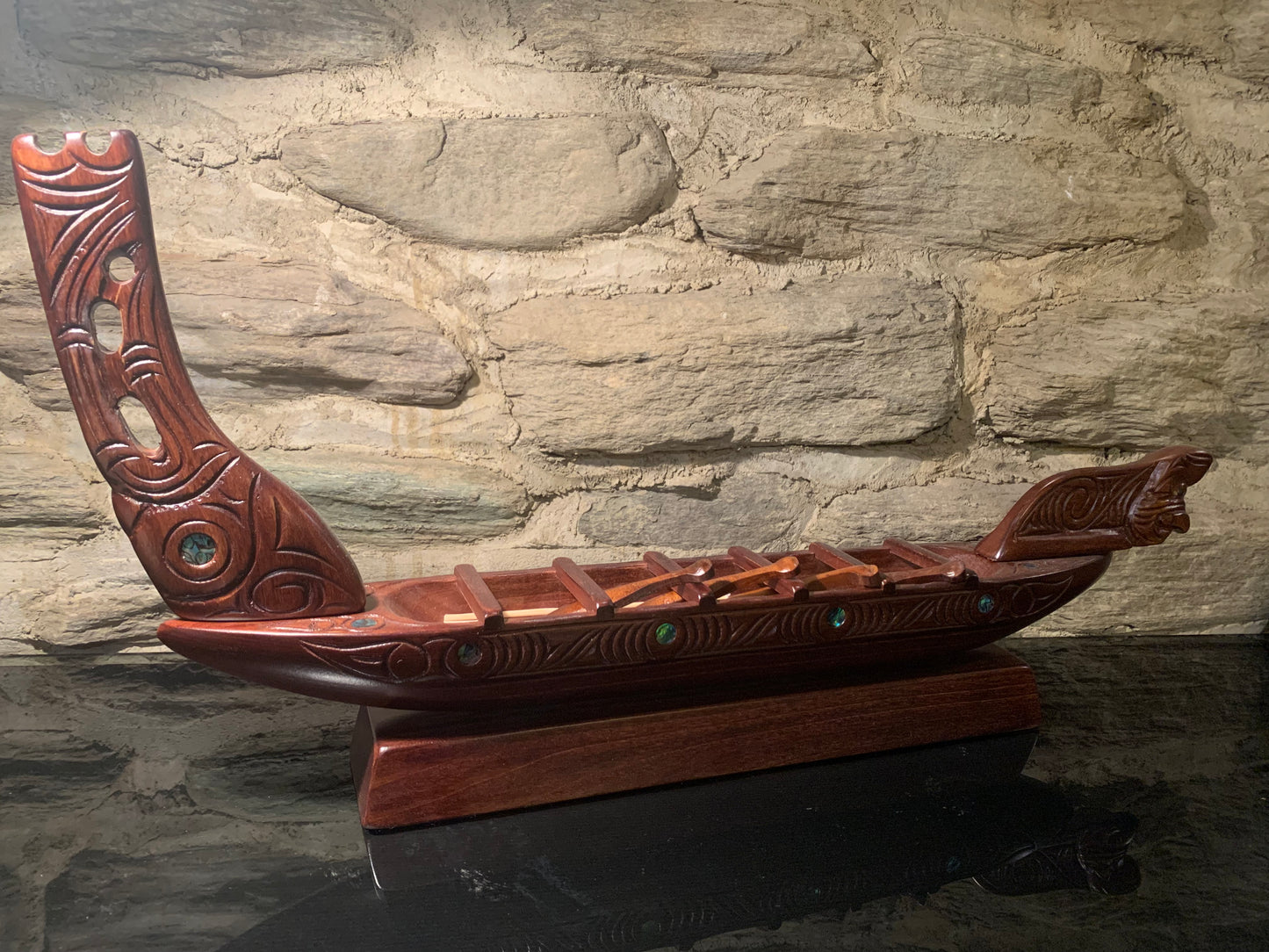 view of Maori small waka canoe carved in New Zealand and available from Silver Fern Gallery