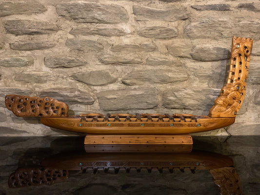 Maori waka taua war canoe carved in New Zealand and available from Silver Fern Gallery