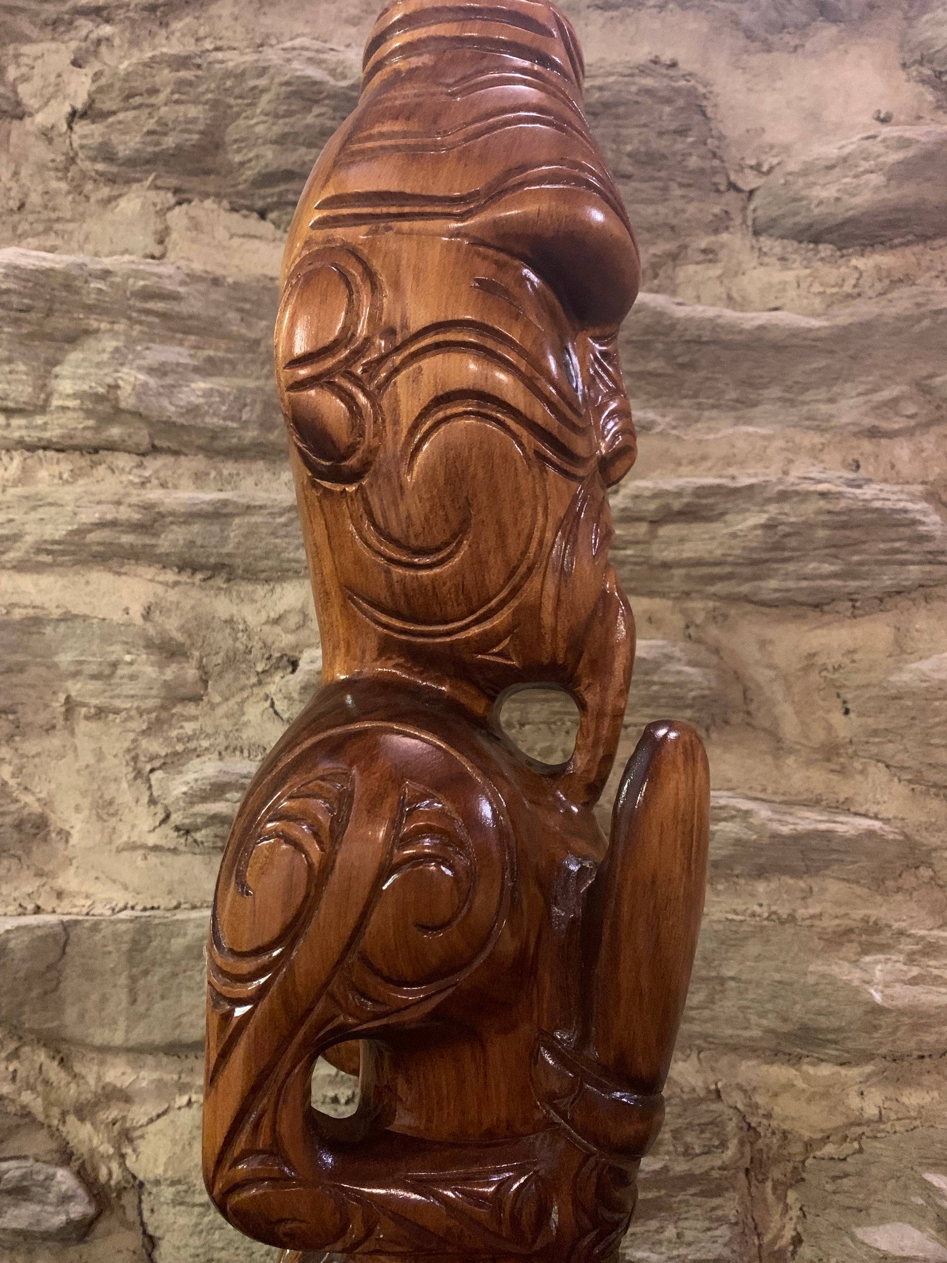 close up to the right of New Zealand Maori Teko Teko Wood Carving by Wood Masters Silver Fern Gallery